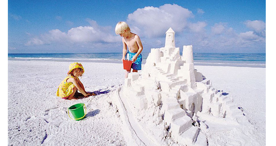 Siesta Key children building sandcastle